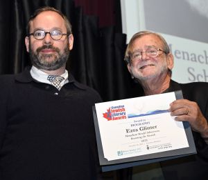 <b>Ezra Glinter</b> receives the Award for Biography from juror Mark Freiman.