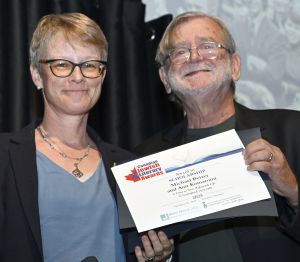 <b>Ann Komaromi</b> receives the Award for Scholarship from juror Mark Freiman.