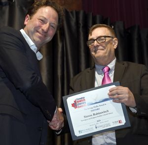 <b>Simon Rabinovitch</b> receives the Irving Abella Award for History from Jury Chair Edward Trapunski.