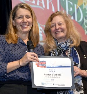<b>Jennifer Lambert</b> of Harper/Collins accepts the Award for Fiction on behalf of <b>Ayelet Tsabari</b> from juror Anna Porter.
